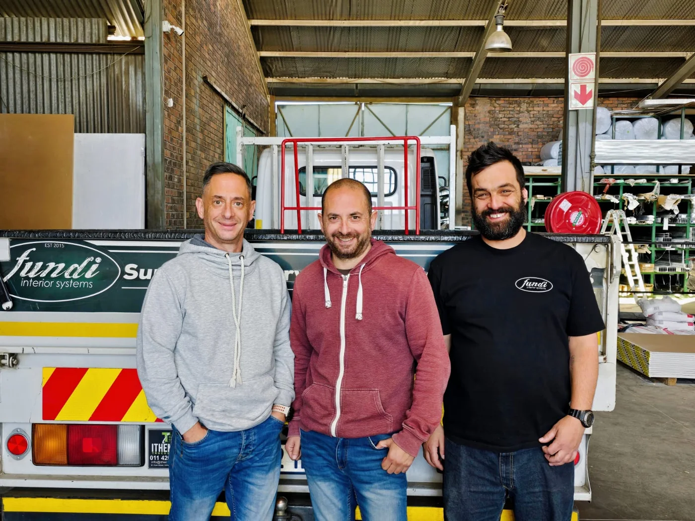 George, Harry and Tyrone — the Fundi team at the delivery truck